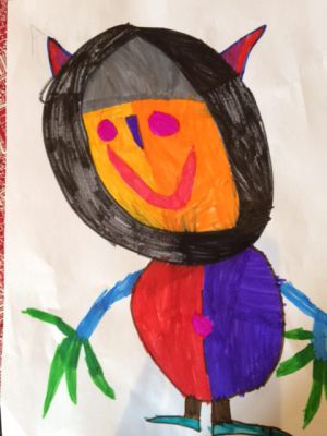 Ein Kind, das eine bunte Kreatur zeichnet